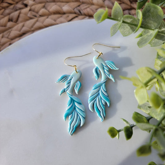 Koi fish earrings in a mix of blues and greens.